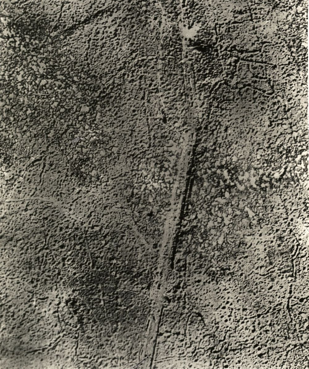 An aerial photograph showing the remains of the Menin Road after the preparatory bombardment during the battle for Passchendaele, 1917.